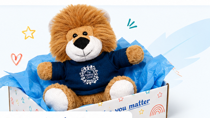 Think Happy lion mascot sitting inside a Welcome Box